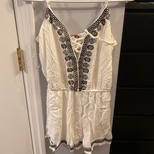 white romper with blue designs size XS